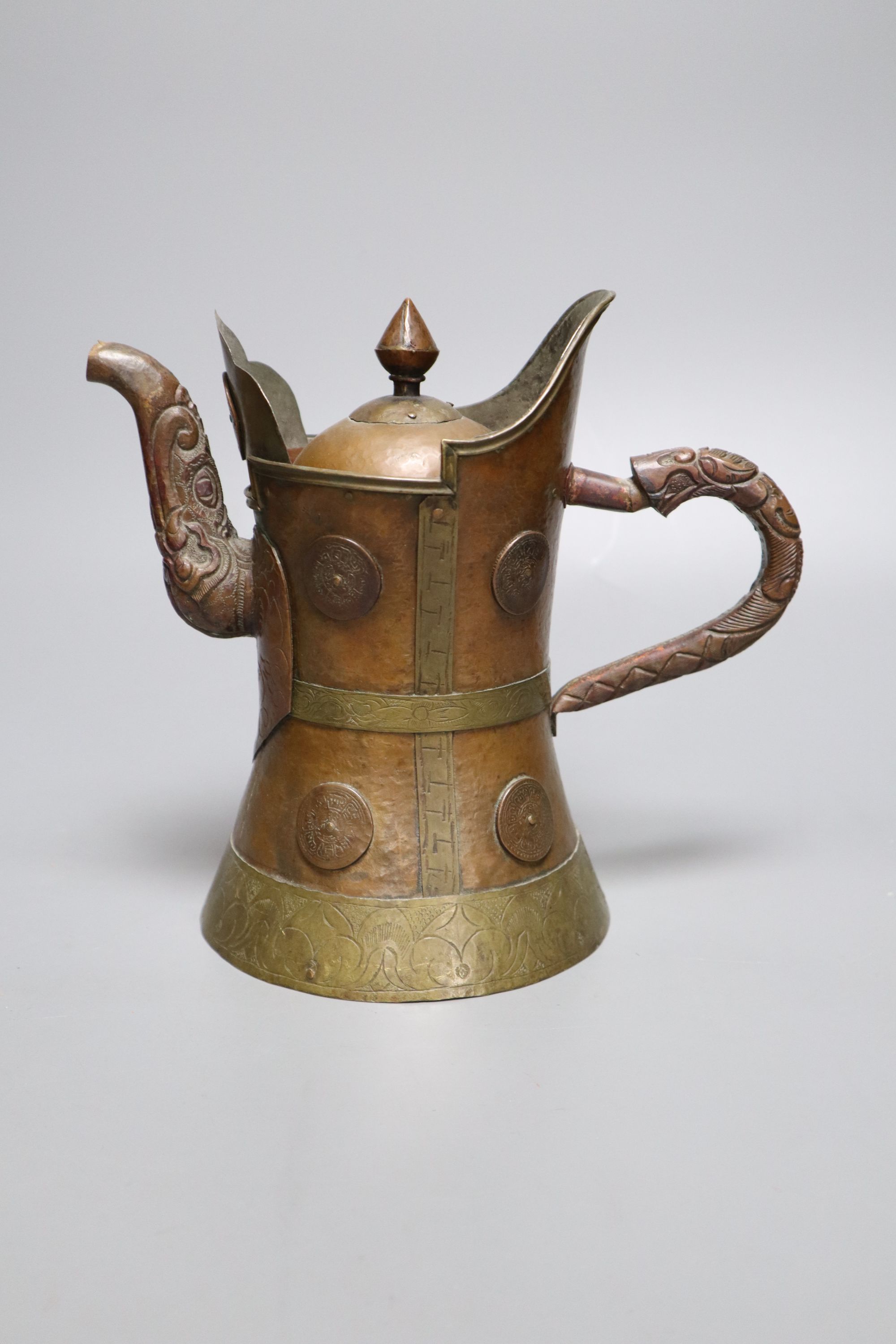 A Himalayan copper and brass teapot, height 20cm